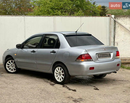 Сірий Міцубісі Lancer, об'ємом двигуна 1.6 л та пробігом 310 тис. км за 3350 $, фото 19 на Automoto.ua