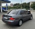 Серый Мицубиси Лансер, объемом двигателя 1.6 л и пробегом 177 тыс. км за 5000 $, фото 7 на Automoto.ua