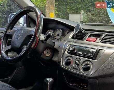 Серый Мицубиси Лансер, объемом двигателя 1.6 л и пробегом 196 тыс. км за 4490 $, фото 26 на Automoto.ua