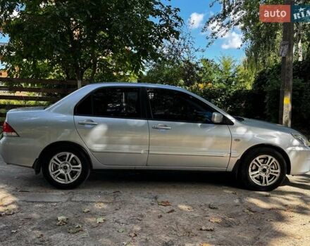 Серый Мицубиси Лансер, объемом двигателя 1.6 л и пробегом 196 тыс. км за 4490 $, фото 5 на Automoto.ua