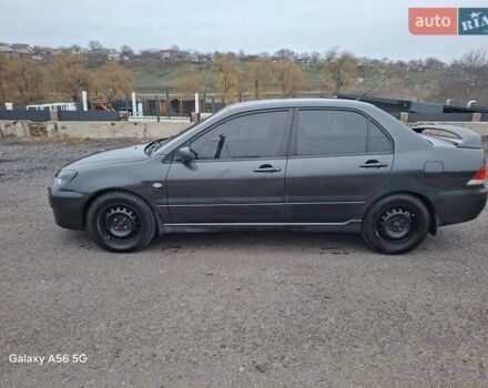 Серый Мицубиси Лансер, объемом двигателя 1.6 л и пробегом 305 тыс. км за 4000 $, фото 7 на Automoto.ua