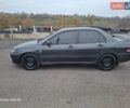 Серый Мицубиси Лансер, объемом двигателя 1.6 л и пробегом 305 тыс. км за 4000 $, фото 7 на Automoto.ua