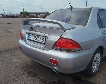 Сірий Міцубісі Lancer, об'ємом двигуна 1.6 л та пробігом 250 тис. км за 4000 $, фото 3 на Automoto.ua