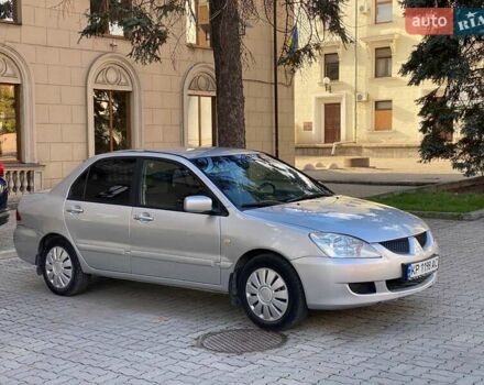 Серый Мицубиси Лансер, объемом двигателя 1.58 л и пробегом 200 тыс. км за 3850 $, фото 2 на Automoto.ua