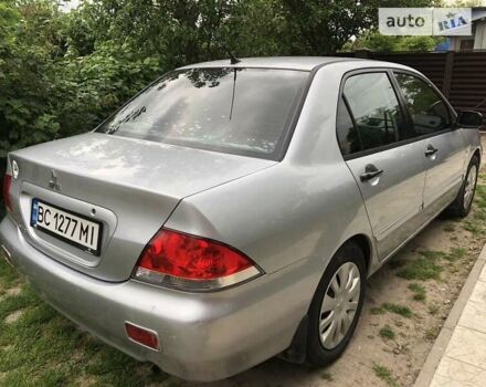 Сірий Міцубісі Lancer, об'ємом двигуна 1.58 л та пробігом 175 тис. км за 4150 $, фото 13 на Automoto.ua