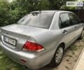 Сірий Міцубісі Lancer, об'ємом двигуна 1.58 л та пробігом 175 тис. км за 4150 $, фото 13 на Automoto.ua