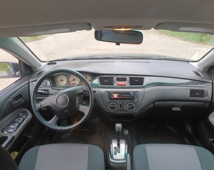 Серый Мицубиси Лансер, объемом двигателя 1.6 л и пробегом 242 тыс. км за 4600 $, фото 6 на Automoto.ua