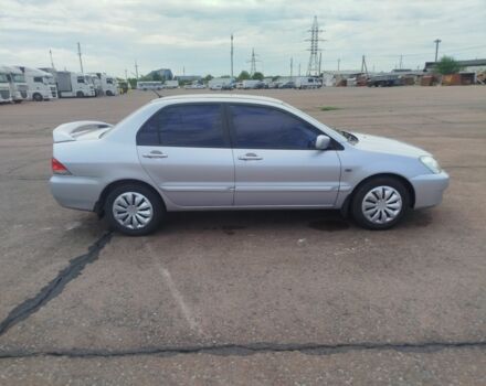 Серый Мицубиси Лансер, объемом двигателя 1.6 л и пробегом 250 тыс. км за 3600 $, фото 10 на Automoto.ua