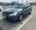 Сірий Міцубісі Lancer, об'ємом двигуна 1.58 л та пробігом 200 тис. км за 4999 $, фото 5 на Automoto.ua