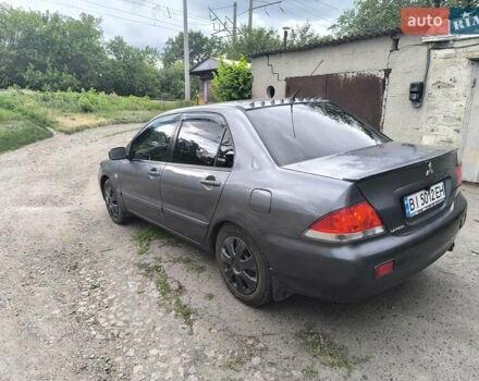 Сірий Міцубісі Lancer, об'ємом двигуна 1.6 л та пробігом 257 тис. км за 3700 $, фото 7 на Automoto.ua