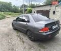 Сірий Міцубісі Lancer, об'ємом двигуна 1.6 л та пробігом 257 тис. км за 3700 $, фото 7 на Automoto.ua