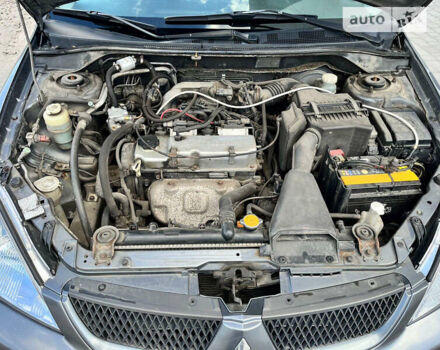 Серый Мицубиси Лансер, объемом двигателя 1.6 л и пробегом 252 тыс. км за 4600 $, фото 7 на Automoto.ua