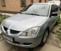 Сірий Міцубісі Lancer, об'ємом двигуна 1.58 л та пробігом 175 тис. км за 4150 $, фото 9 на Automoto.ua