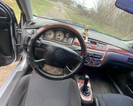 Серый Мицубиси Лансер, объемом двигателя 1.58 л и пробегом 210 тыс. км за 3900 $, фото 8 на Automoto.ua