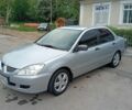 Серый Мицубиси Лансер, объемом двигателя 1.6 л и пробегом 227 тыс. км за 3400 $, фото 1 на Automoto.ua