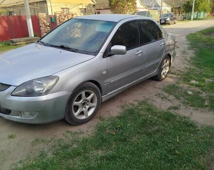 Серый Мицубиси Лансер, объемом двигателя 1.6 л и пробегом 199 тыс. км за 3300 $, фото 2 на Automoto.ua