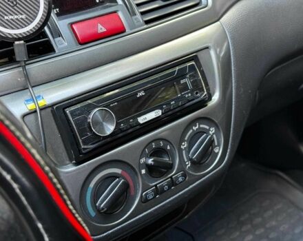 Серый Мицубиси Лансер, объемом двигателя 1.6 л и пробегом 196 тыс. км за 4390 $, фото 19 на Automoto.ua