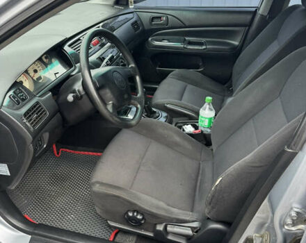 Серый Мицубиси Лансер, объемом двигателя 1.58 л и пробегом 260 тыс. км за 3500 $, фото 9 на Automoto.ua