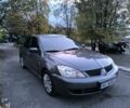 Серый Мицубиси Лансер, объемом двигателя 1.6 л и пробегом 250 тыс. км за 4937 $, фото 1 на Automoto.ua