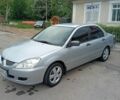 Серый Мицубиси Лансер, объемом двигателя 1.6 л и пробегом 229 тыс. км за 3400 $, фото 1 на Automoto.ua