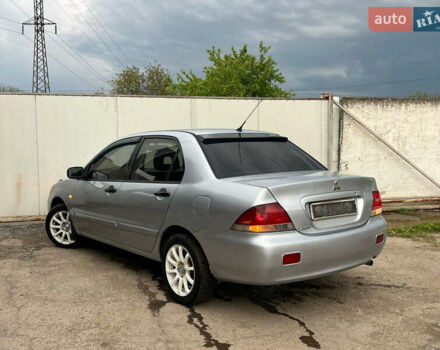 Сірий Міцубісі Lancer, об'ємом двигуна 1.6 л та пробігом 310 тис. км за 3350 $, фото 14 на Automoto.ua