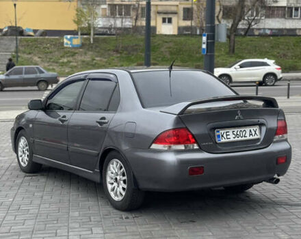 Серый Мицубиси Лансер, объемом двигателя 1.58 л и пробегом 237 тыс. км за 2999 $, фото 2 на Automoto.ua