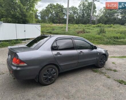 Сірий Міцубісі Lancer, об'ємом двигуна 1.6 л та пробігом 257 тис. км за 3700 $, фото 3 на Automoto.ua