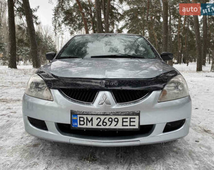 Серый Мицубиси Лансер, объемом двигателя 1.58 л и пробегом 225 тыс. км за 3950 $, фото 3 на Automoto.ua