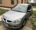 Сірий Міцубісі Lancer, об'ємом двигуна 1.58 л та пробігом 175 тис. км за 4150 $, фото 7 на Automoto.ua