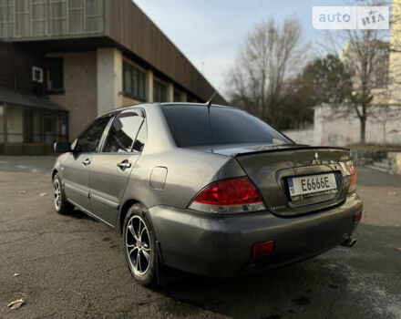 Сірий Міцубісі Lancer, об'ємом двигуна 1.58 л та пробігом 338 тис. км за 4700 $, фото 4 на Automoto.ua