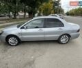 Серый Мицубиси Лансер, объемом двигателя 1.58 л и пробегом 165 тыс. км за 3800 $, фото 2 на Automoto.ua