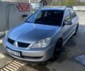 Серый Мицубиси Лансер, объемом двигателя 1.6 л и пробегом 283 тыс. км за 4000 $, фото 1 на Automoto.ua
