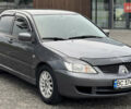 Сірий Міцубісі Lancer, об'ємом двигуна 1.58 л та пробігом 223 тис. км за 3599 $, фото 2 на Automoto.ua