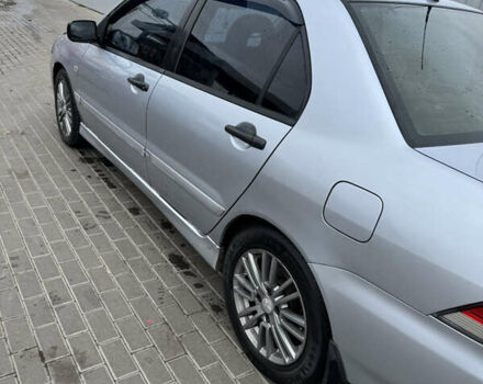 Серый Мицубиси Лансер, объемом двигателя 1.58 л и пробегом 260 тыс. км за 3500 $, фото 1 на Automoto.ua