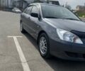 Сірий Міцубісі Lancer, об'ємом двигуна 1.58 л та пробігом 200 тис. км за 4999 $, фото 1 на Automoto.ua