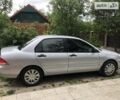 Сірий Міцубісі Lancer, об'ємом двигуна 1.58 л та пробігом 175 тис. км за 4150 $, фото 3 на Automoto.ua