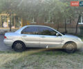 Сірий Міцубісі Lancer, об'ємом двигуна 1.58 л та пробігом 290 тис. км за 3500 $, фото 3 на Automoto.ua