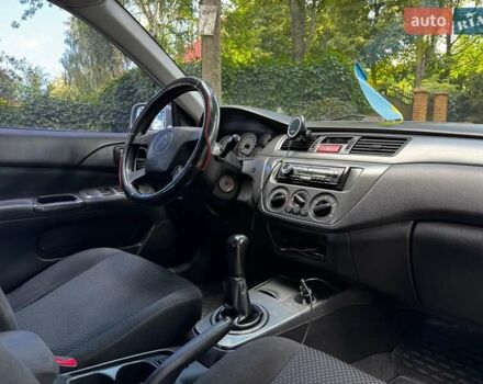 Серый Мицубиси Лансер, объемом двигателя 1.6 л и пробегом 196 тыс. км за 4490 $, фото 25 на Automoto.ua