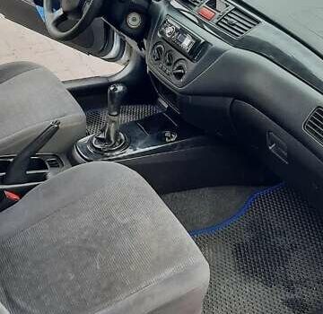 Серый Мицубиси Лансер, объемом двигателя 1.6 л и пробегом 277 тыс. км за 3500 $, фото 5 на Automoto.ua