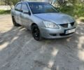 Серый Мицубиси Лансер, объемом двигателя 1.6 л и пробегом 330 тыс. км за 2500 $, фото 1 на Automoto.ua
