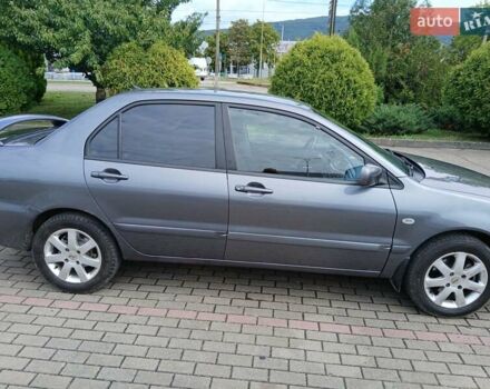 Сірий Міцубісі Lancer, об'ємом двигуна 1.58 л та пробігом 200 тис. км за 4000 $, фото 7 на Automoto.ua