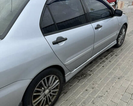 Серый Мицубиси Лансер, объемом двигателя 1.58 л и пробегом 260 тыс. км за 3500 $, фото 2 на Automoto.ua