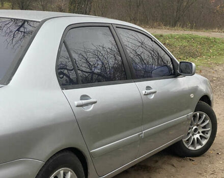 Серый Мицубиси Лансер, объемом двигателя 1.58 л и пробегом 210 тыс. км за 3900 $, фото 2 на Automoto.ua