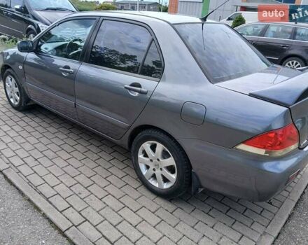 Сірий Міцубісі Lancer, об'ємом двигуна 1.58 л та пробігом 200 тис. км за 4000 $, фото 1 на Automoto.ua