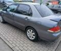 Серый Мицубиси Лансер, объемом двигателя 1.58 л и пробегом 200 тыс. км за 4500 $, фото 1 на Automoto.ua