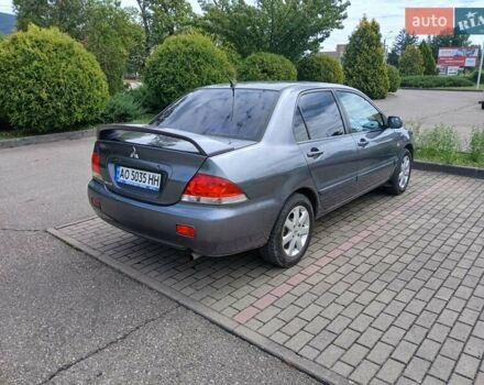 Сірий Міцубісі Lancer, об'ємом двигуна 1.58 л та пробігом 200 тис. км за 4000 $, фото 3 на Automoto.ua
