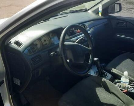 Сірий Міцубісі Lancer, об'ємом двигуна 1.58 л та пробігом 250 тис. км за 5000 $, фото 1 на Automoto.ua