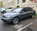 Серый Мицубиси Лансер, объемом двигателя 1.58 л и пробегом 293 тыс. км за 4000 $, фото 1 на Automoto.ua