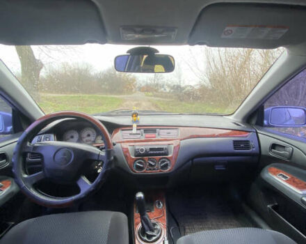 Серый Мицубиси Лансер, объемом двигателя 1.58 л и пробегом 210 тыс. км за 3900 $, фото 7 на Automoto.ua