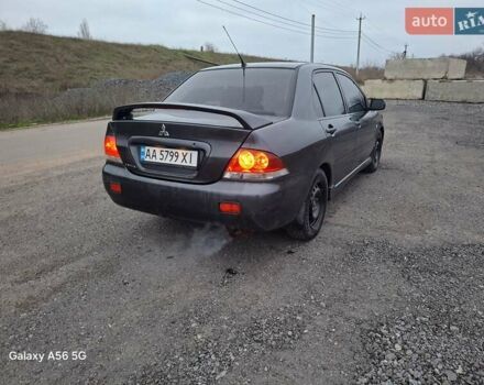 Серый Мицубиси Лансер, объемом двигателя 1.6 л и пробегом 305 тыс. км за 4000 $, фото 2 на Automoto.ua